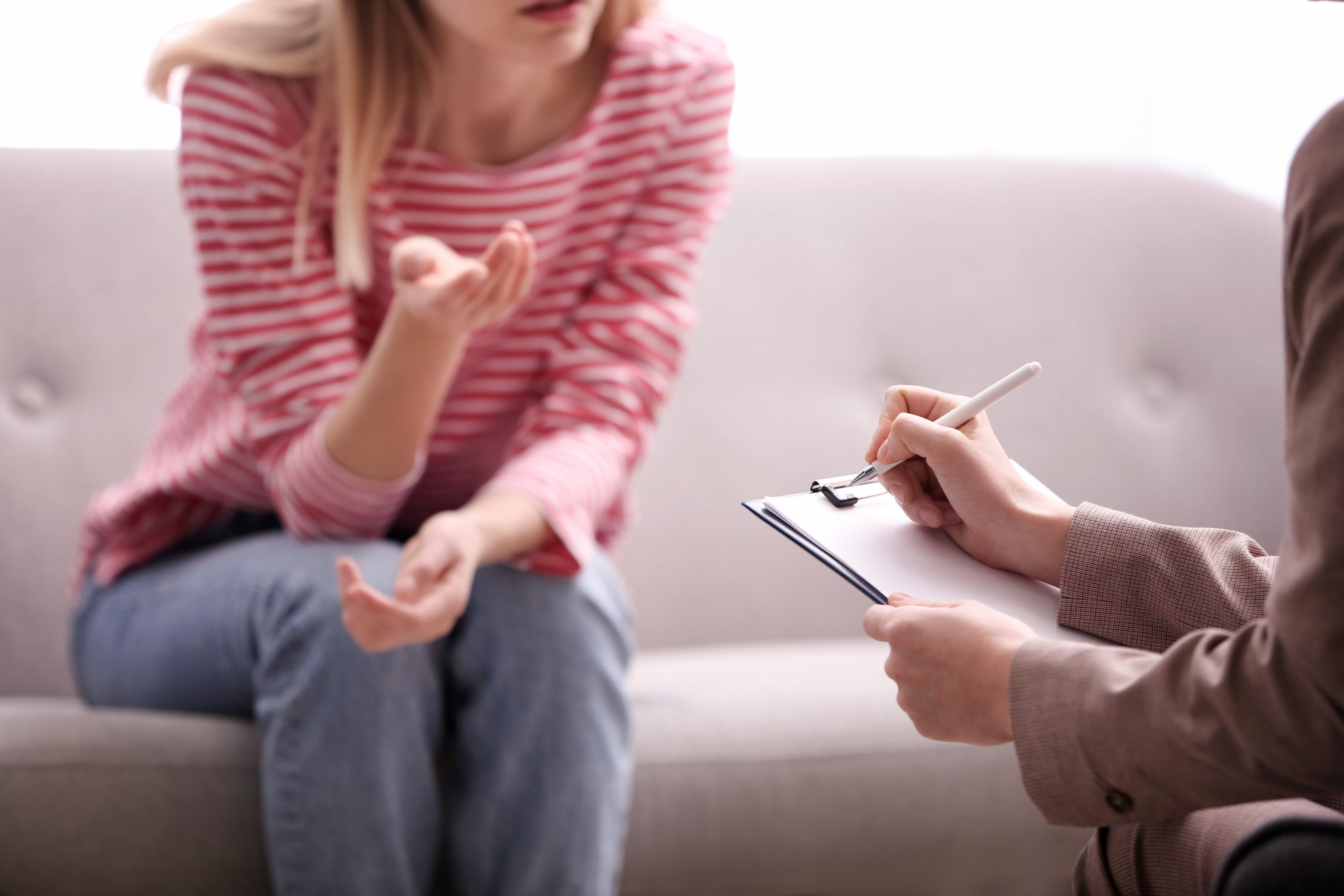 Two ladies engage in therapy session